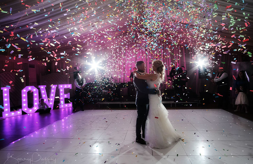 Confetti machine rental with Marquee sign rentals at a wedding.